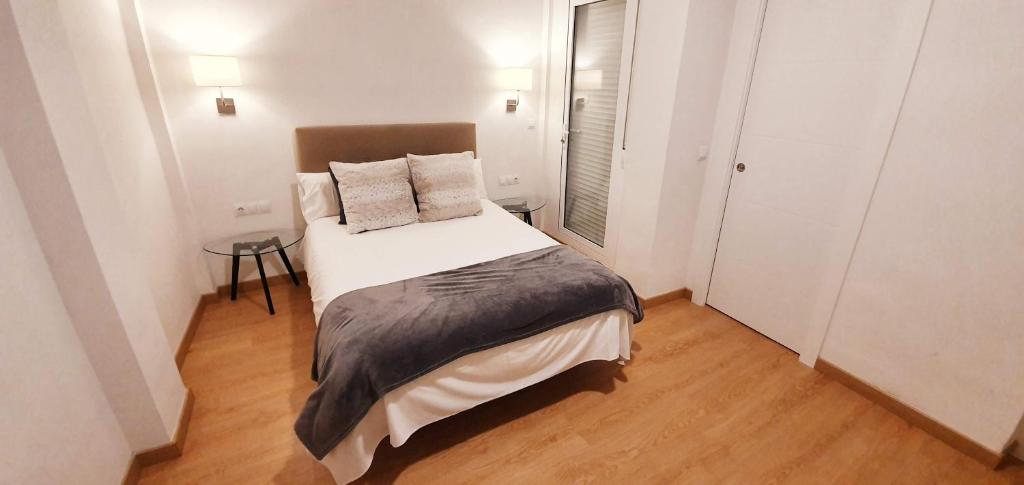 Postel nebo postele na pokoji v ubytování Fan Rooms Gálvez