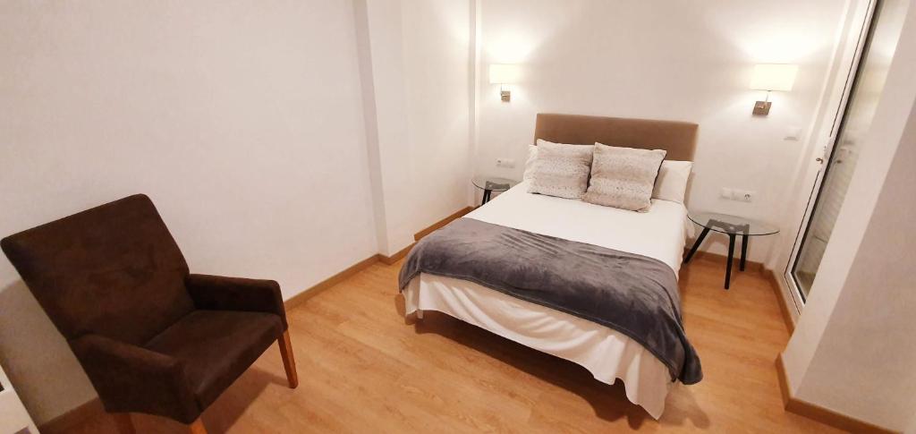 Postel nebo postele na pokoji v ubytování Fan Rooms Gálvez