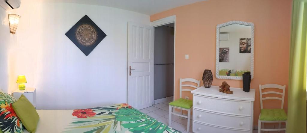 Postel nebo postele na pokoji v ubytování Villa Rosa Karibella