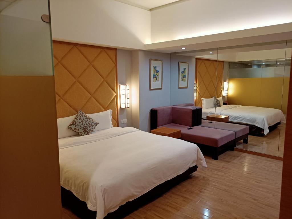 Postel nebo postele na pokoji v ubytování Dongguan Well Garden Hotel