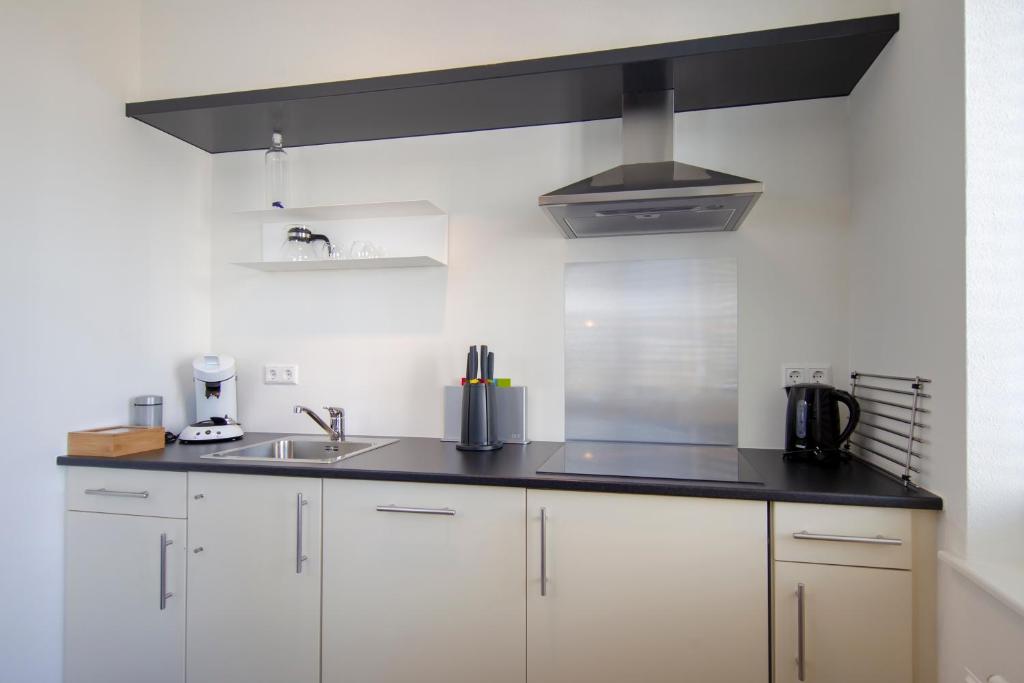 Cuisine ou kitchenette dans l'établissement Seapoint - Sea view