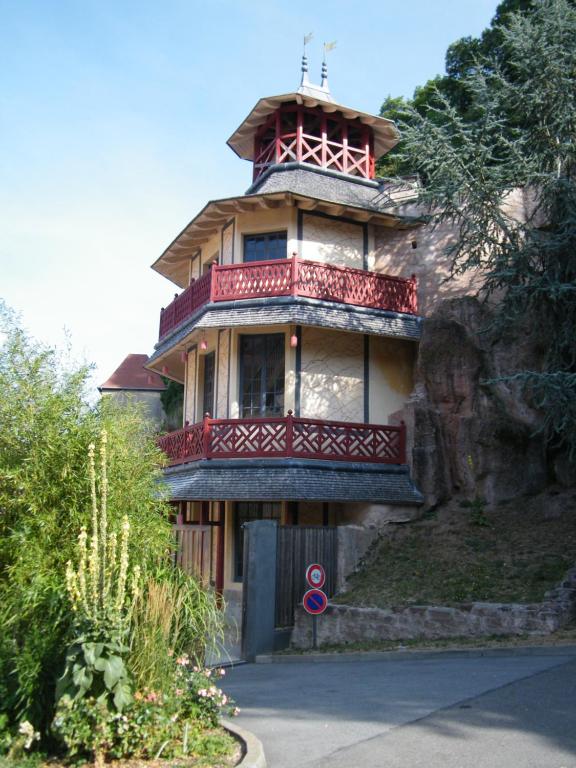 a large building with a balcony on top of it at Chez Laurent et Sandrine in Chantraine