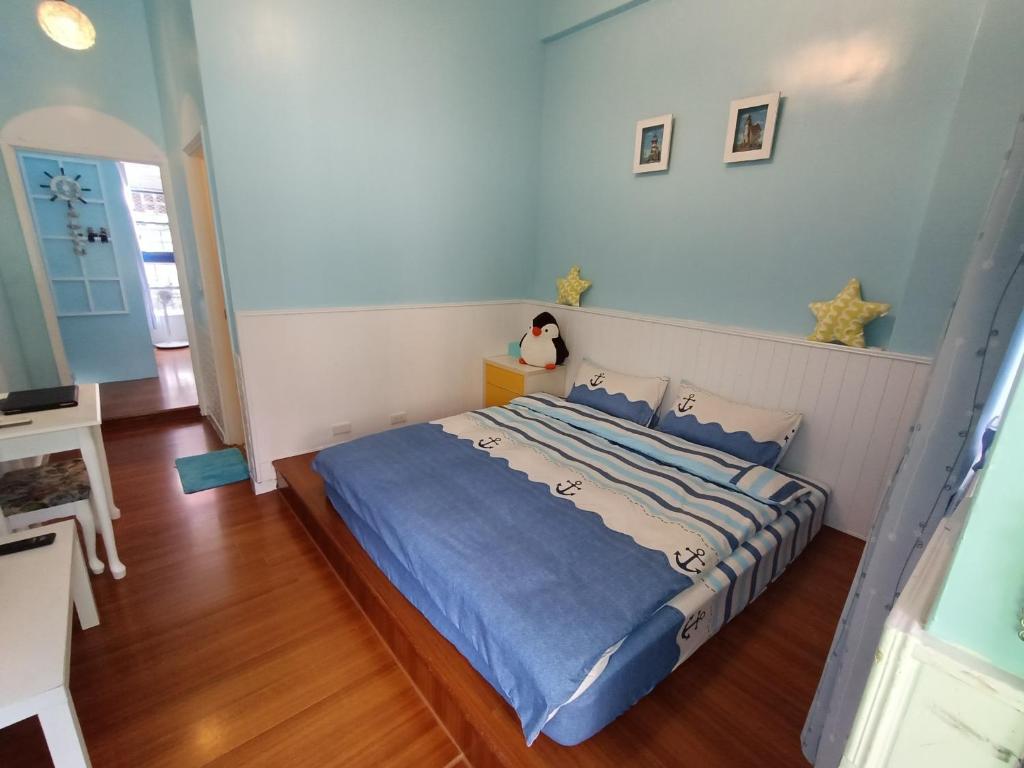 Postel nebo postele na pokoji v ubytování 水里河堤咖啡民宿 Shuili Heti coffee B&B