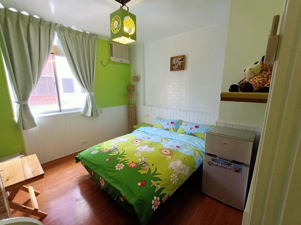 Postel nebo postele na pokoji v ubytování 水里河堤咖啡民宿 Shuili Heti coffee B&B