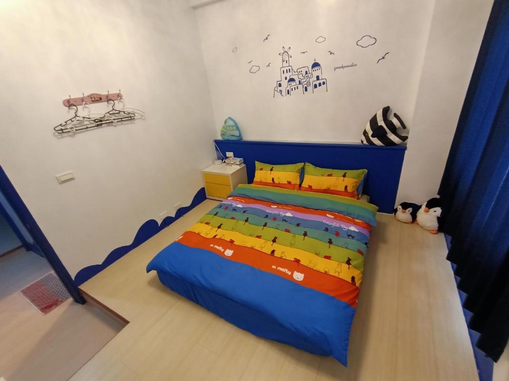 Postel nebo postele na pokoji v ubytování 水里河堤咖啡民宿 Shuili Heti coffee B&B