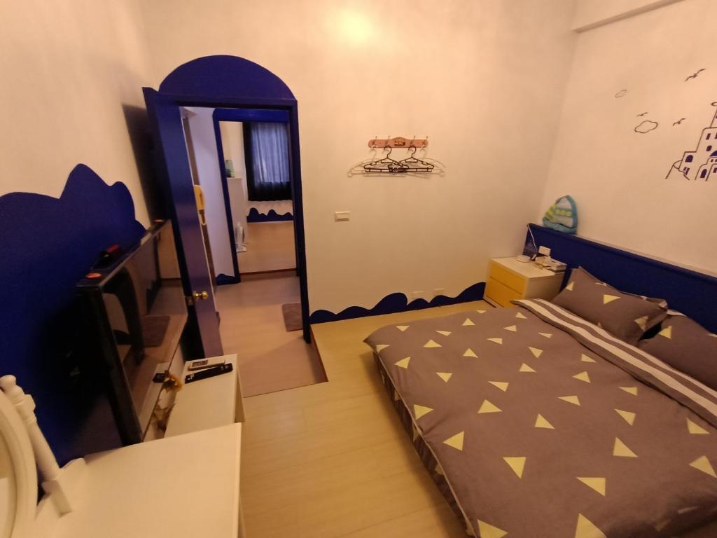 Postel nebo postele na pokoji v ubytování 水里河堤咖啡民宿 Shuili Heti coffee B&B