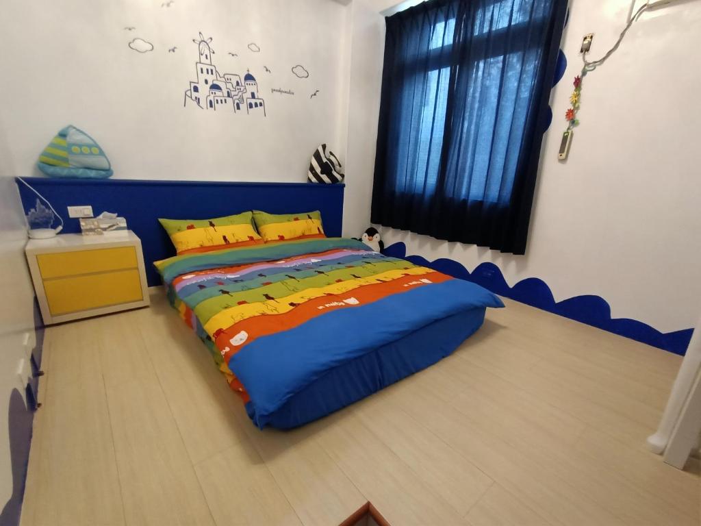 Postel nebo postele na pokoji v ubytování 水里河堤咖啡民宿 Shuili Heti coffee B&B