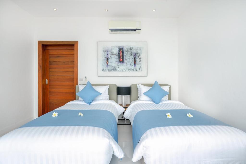 Ένα ή περισσότερα κρεβάτια σε δωμάτιο στο Villa Claire - Seaview Private Villa