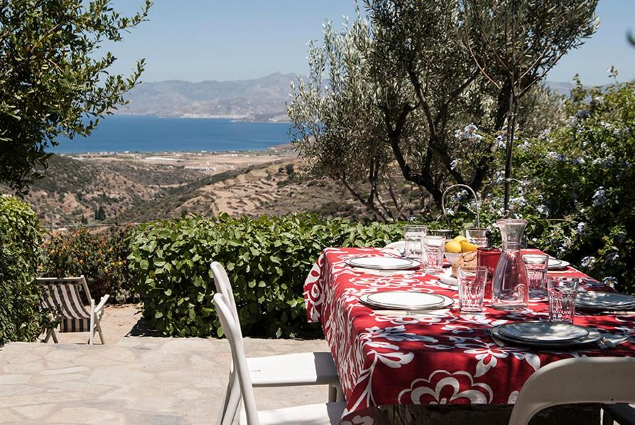 a table with a red and white table cloth on it at Exquisite estate, serene environment in Lefkes