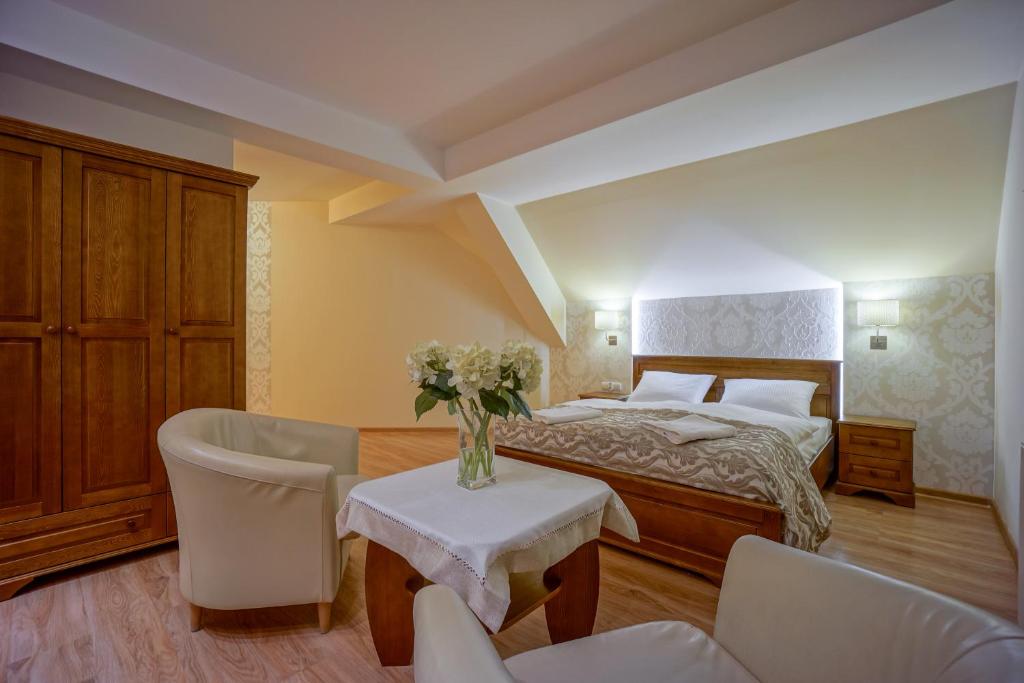 Posteľ alebo postele v izbe v ubytovaní Jawor Pokoje i Apartamenty