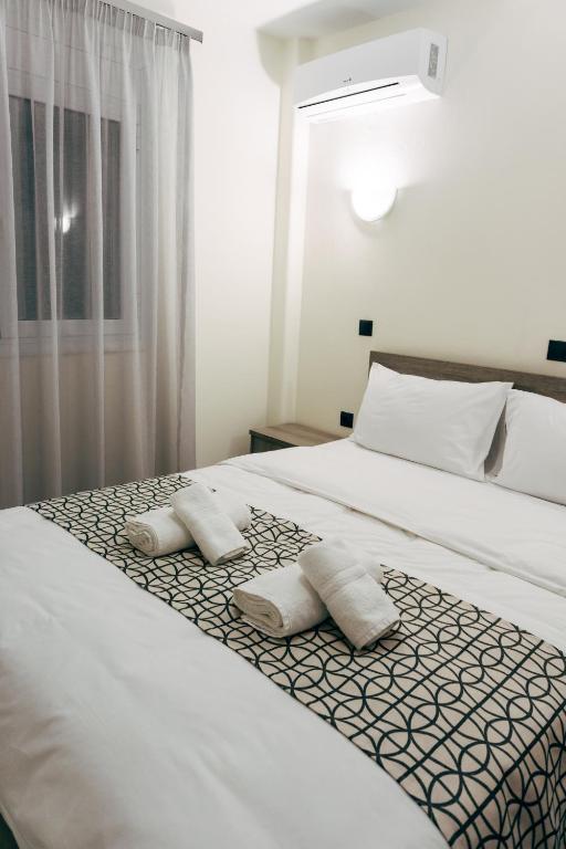Postel nebo postele na pokoji v ubytování Pravi Hotel