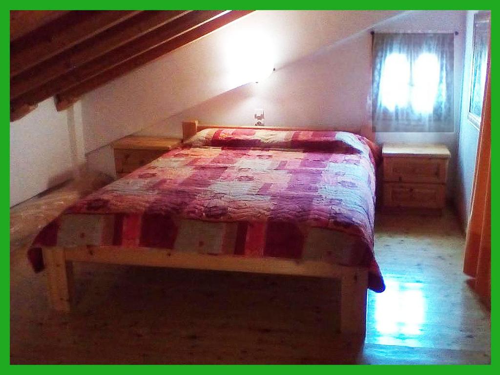 Postel nebo postele na pokoji v ubytování Kampos View Ikaria