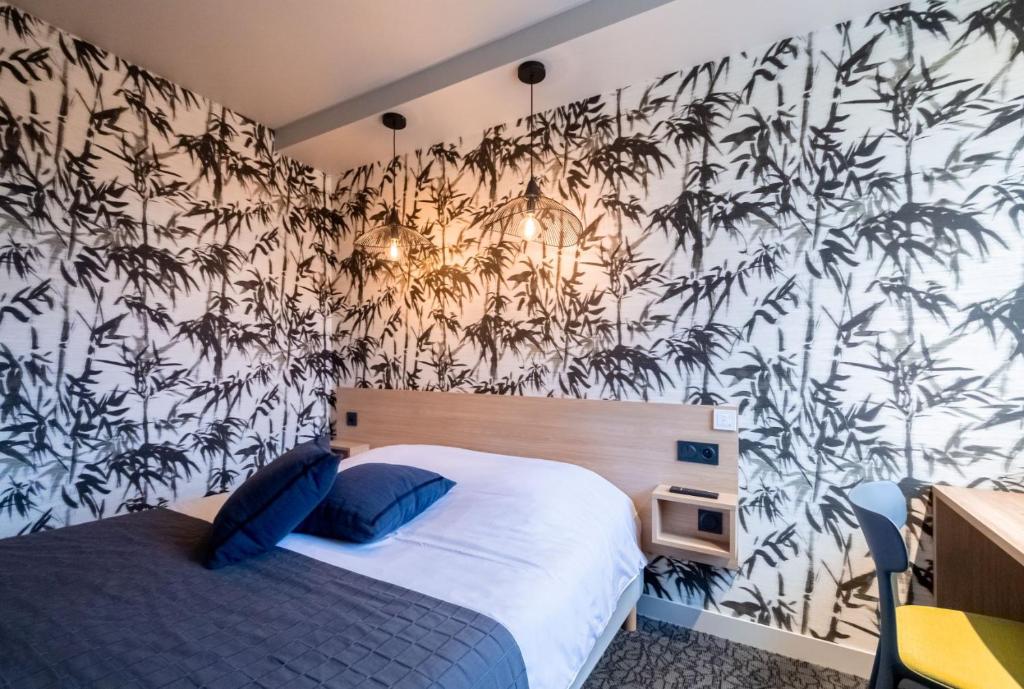 Postel nebo postele na pokoji v ubytování Sous Les Pins