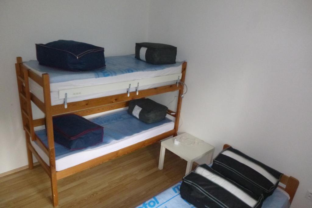 Postel nebo postele na pokoji v ubytování Holiday House Javornik