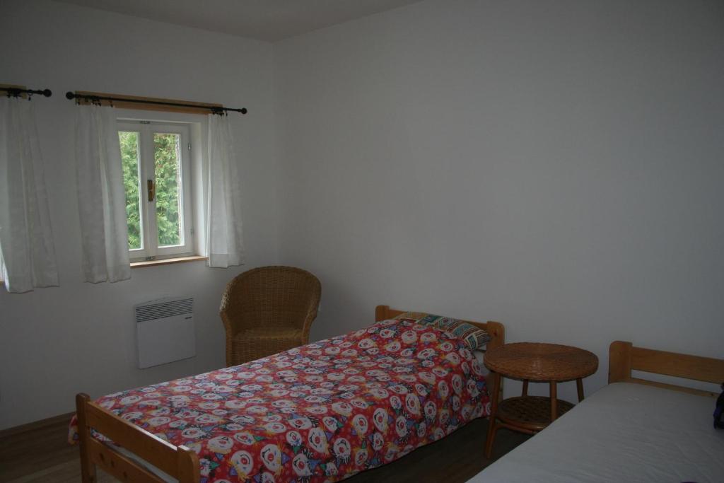 Postel nebo postele na pokoji v ubytování Holiday House Javornik