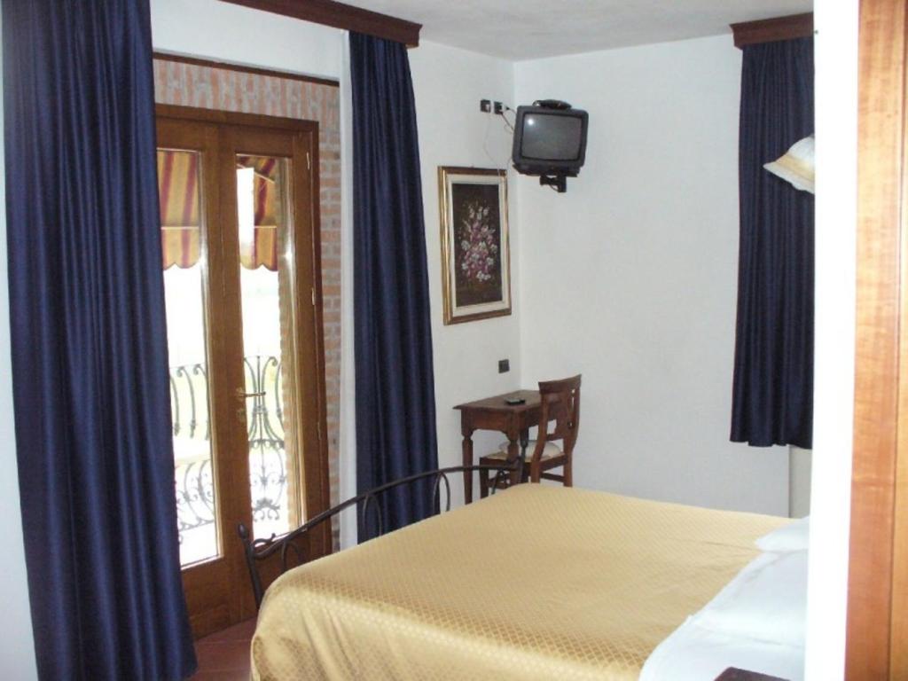 Posteľ alebo postele v izbe v ubytovaní Agriturismo Corte Trincerone
