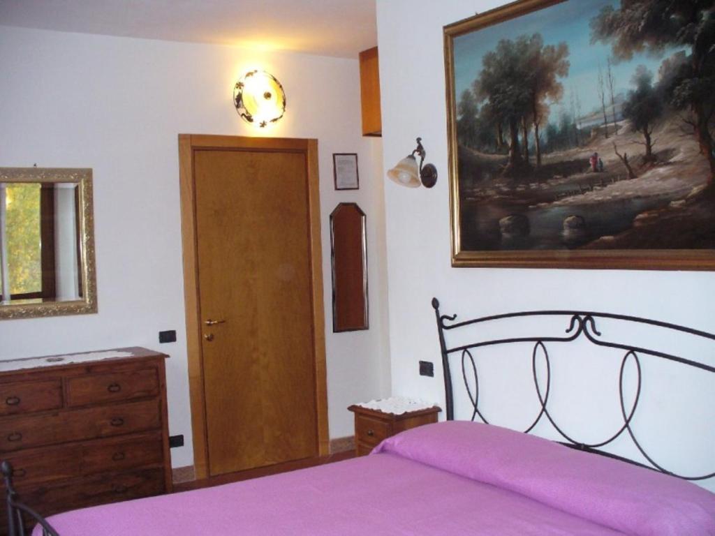 Posteľ alebo postele v izbe v ubytovaní Agriturismo Corte Trincerone
