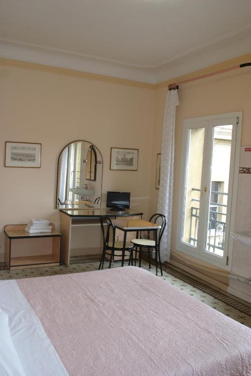 Łóżko lub łóżka w pokoju w obiekcie Hotel Panorama Bologna Centro