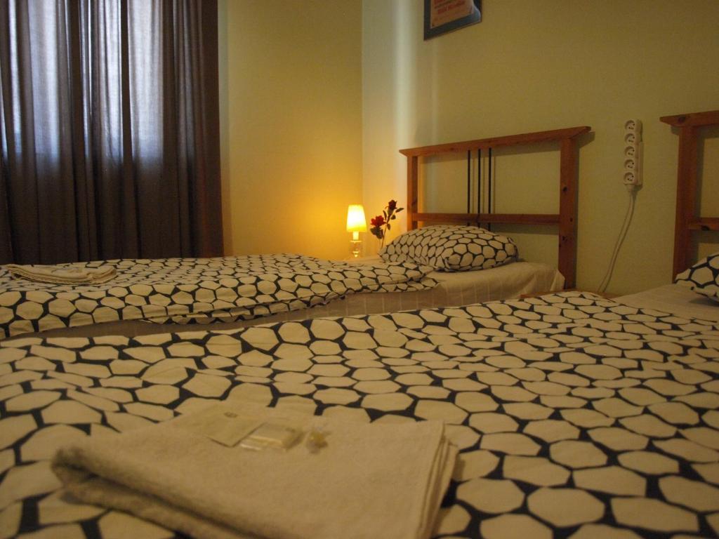 Postel nebo postele na pokoji v ubytování Apartmány Rossa