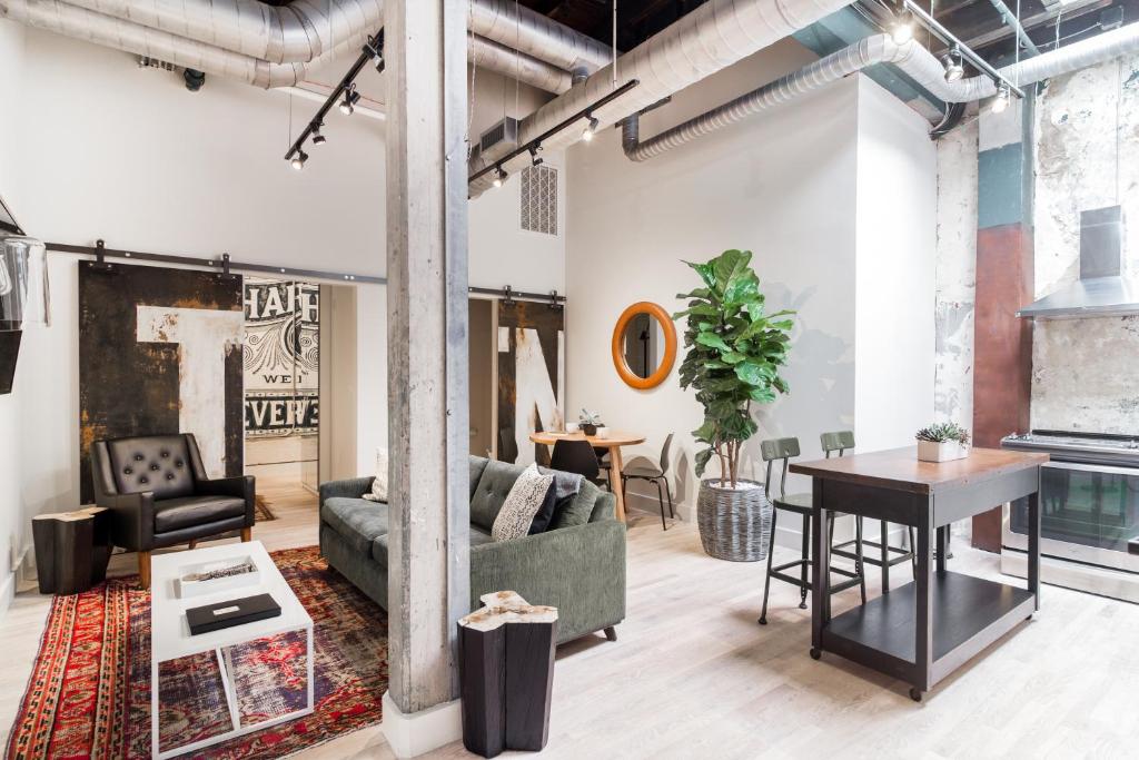 a living room with a couch and a table at 506 Lofts in Nashville