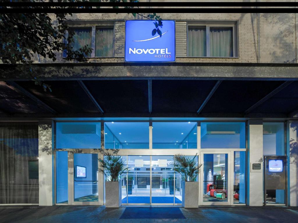 a novation sign on the front of a building at Novotel Leuven Centrum in Leuven