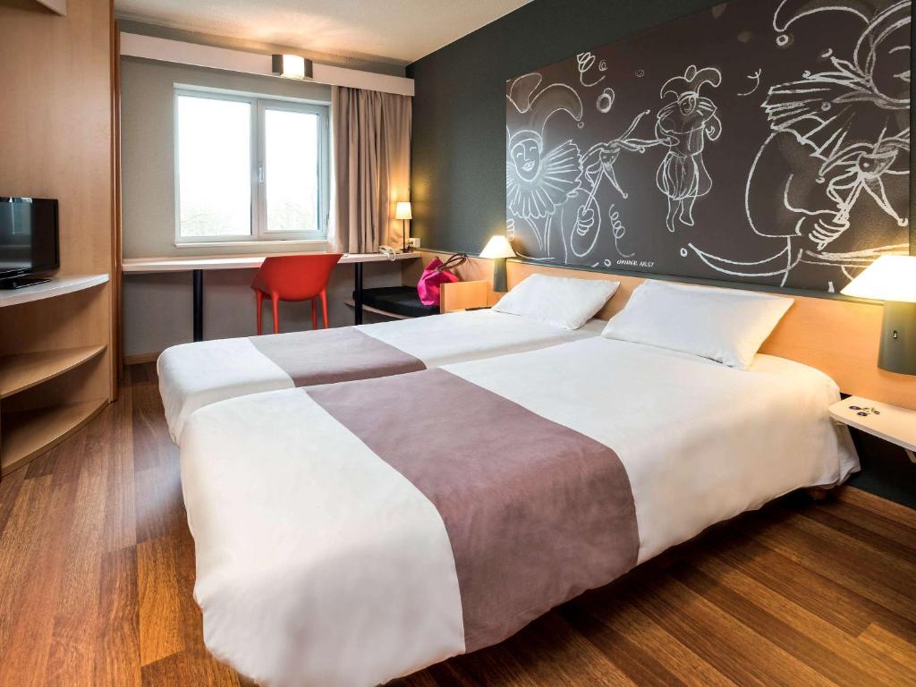Postel nebo postele na pokoji v ubytování ibis Aalst