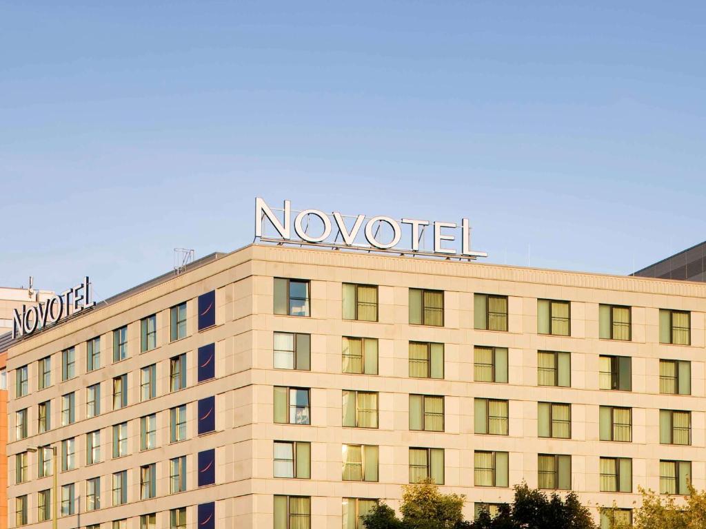 a large building with a clock on the front of it at Novotel Berlin Mitte in Berlin