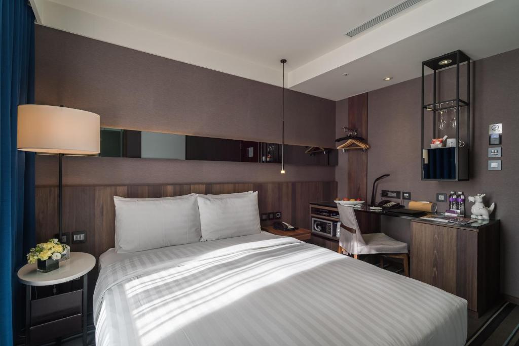 Postel nebo postele na pokoji v ubytování WESTGATE Hotel