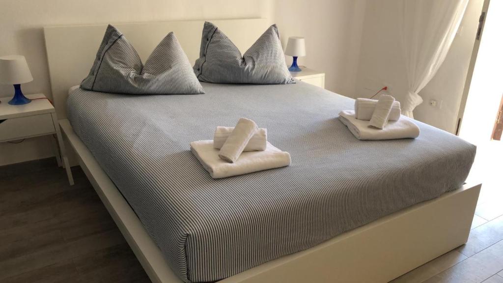 Posteľ alebo postele v izbe v ubytovaní Le Sabbie Nere