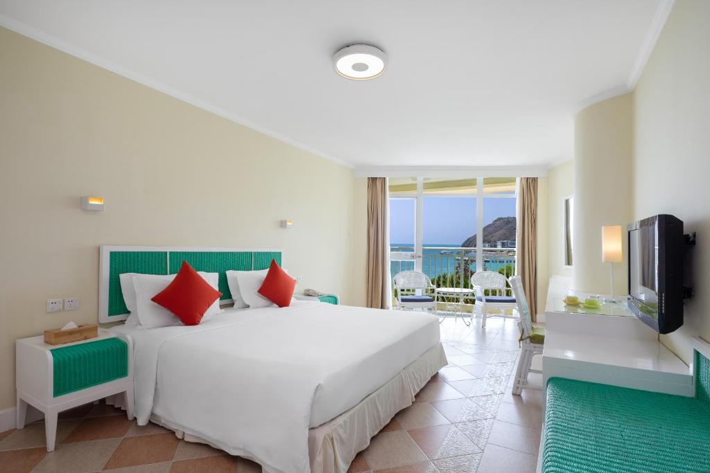 Кровать или кровати в номере Sunshine Resort Intime Sanya