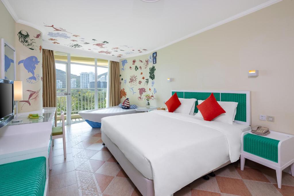 Кровать или кровати в номере Sunshine Resort Intime Sanya