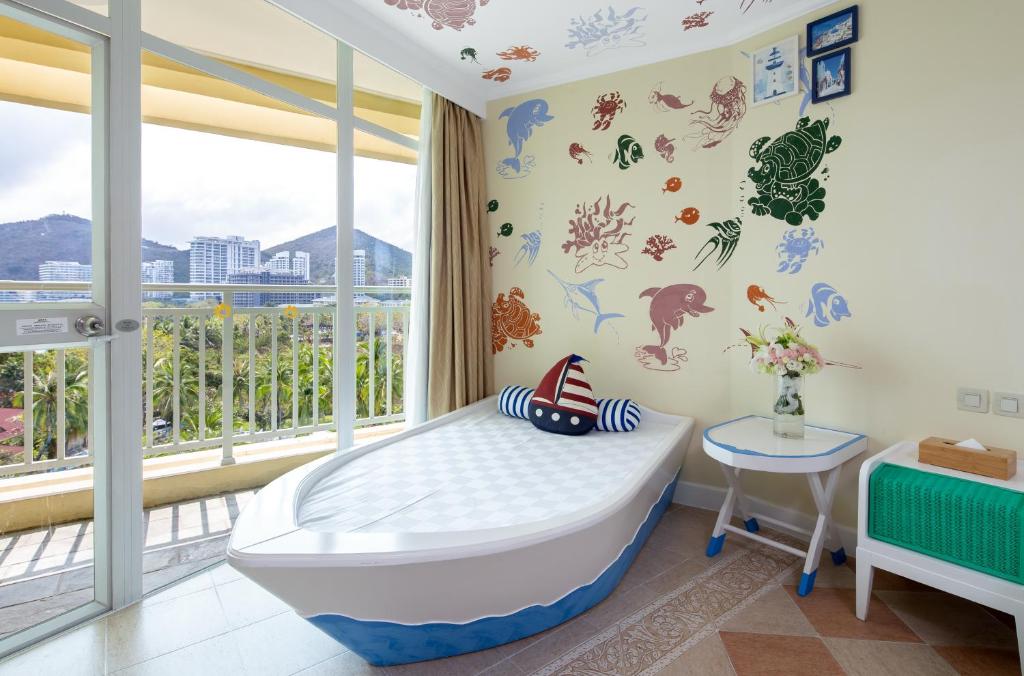 Кровать или кровати в номере Sunshine Resort Intime Sanya