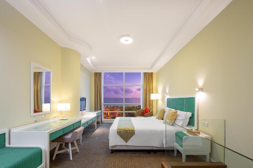 Кровать или кровати в номере Sunshine Resort Intime Sanya