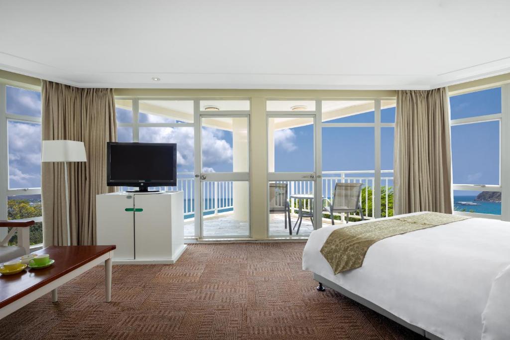 Кровать или кровати в номере Sunshine Resort Intime Sanya