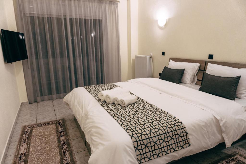Postel nebo postele na pokoji v ubytování Pravi Hotel