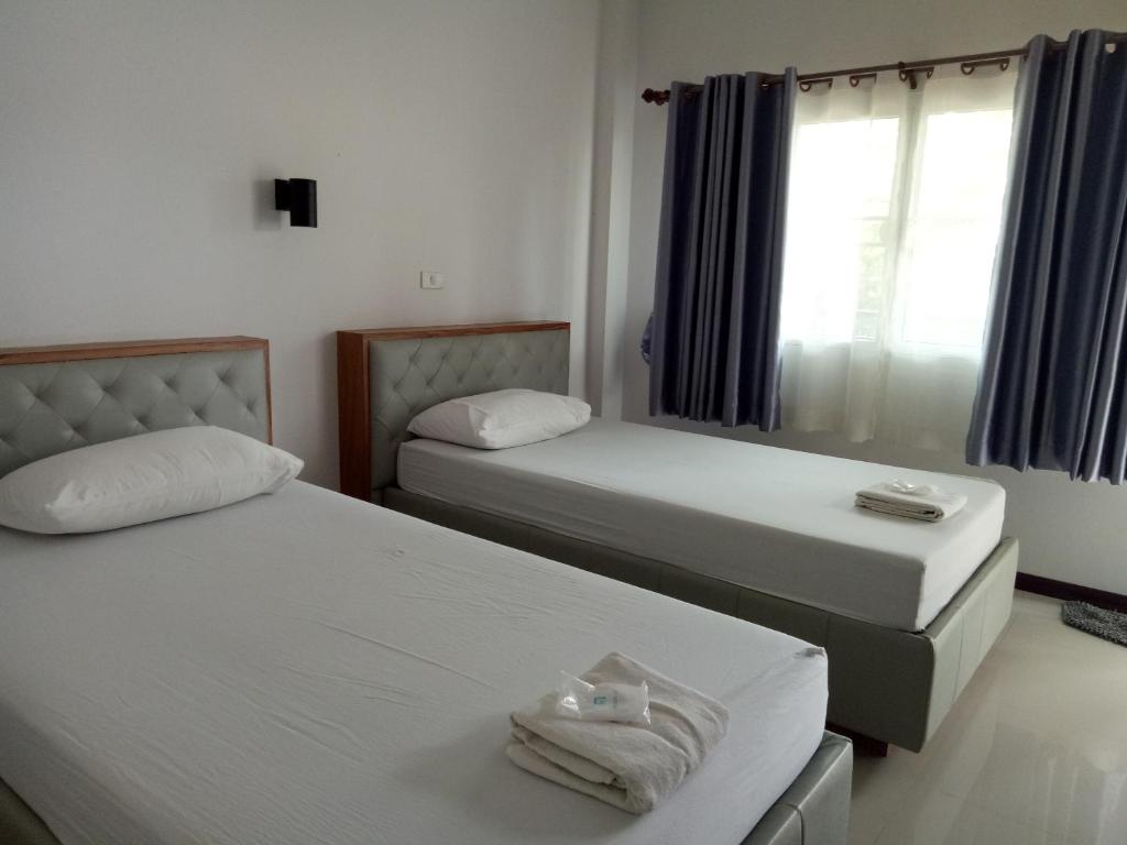 Postel nebo postele na pokoji v ubytování เคียงเลิงรีสอร์ท