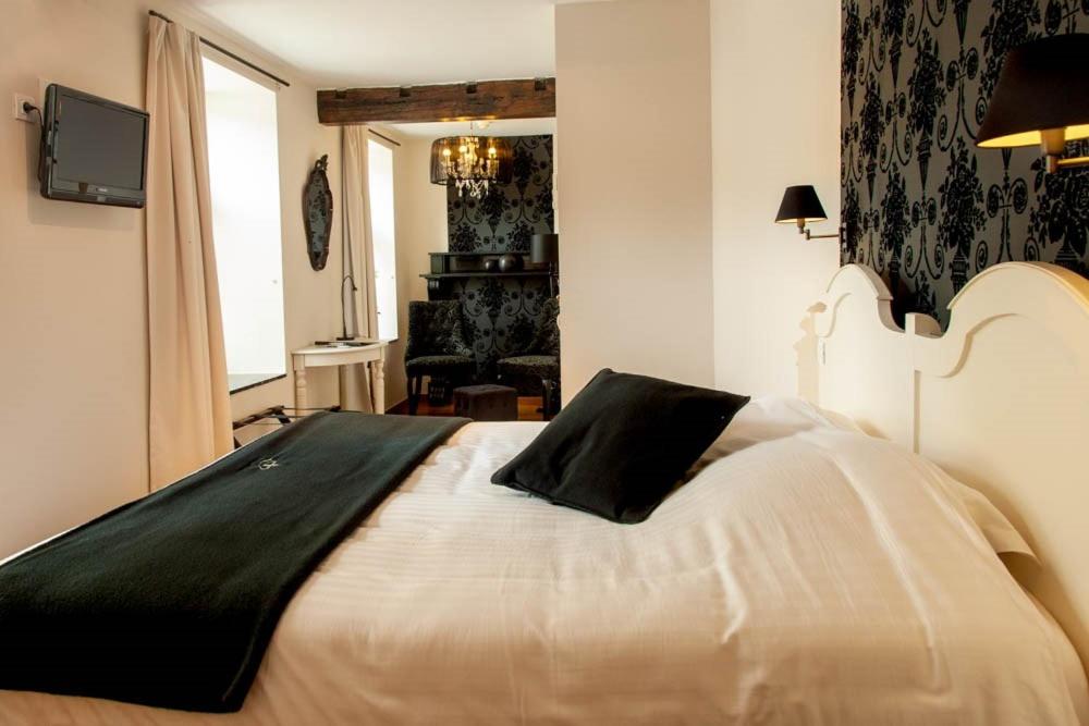 Postel nebo postele na pokoji v ubytování Hotel Le Saint Hadelin