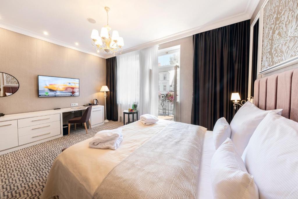 Postel nebo postele na pokoji v ubytování Spa Hotel ULRIKA