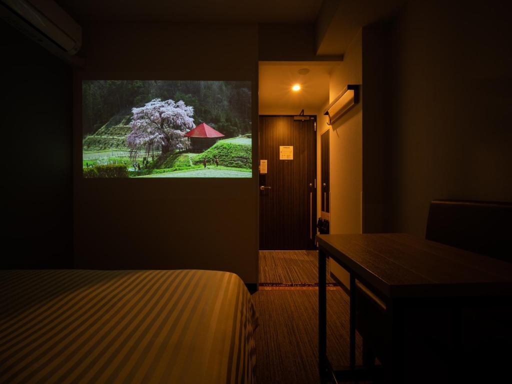Postel nebo postele na pokoji v ubytování Super Hotel Okayama Station Higashiguchi