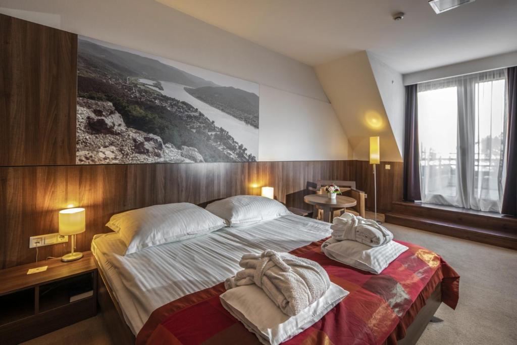 Postel nebo postele na pokoji v ubytování Royal Club Hotel