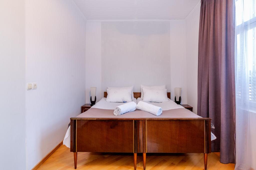 Postel nebo postele na pokoji v ubytování Guesthouse Alvani
