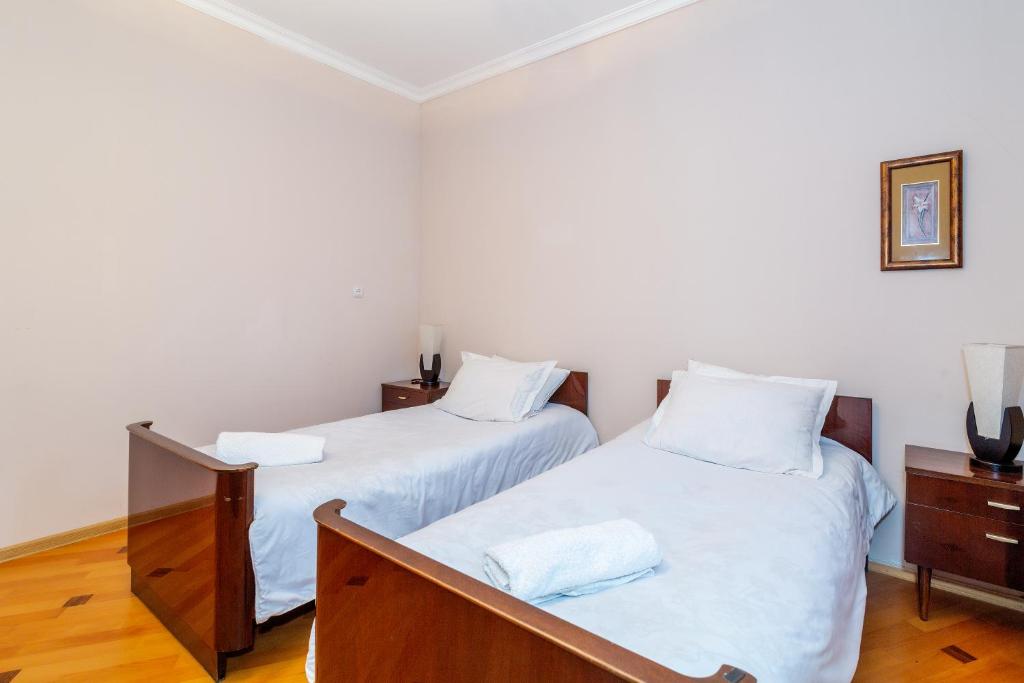 Postel nebo postele na pokoji v ubytování Guesthouse Alvani