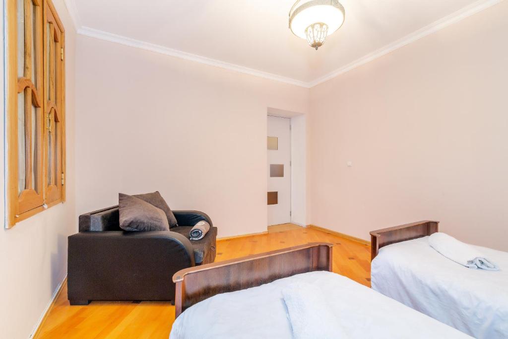 Postel nebo postele na pokoji v ubytování Guesthouse Alvani