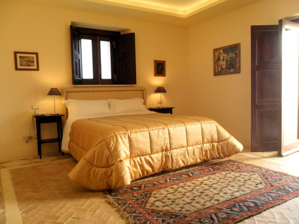 Posteľ alebo postele v izbe v ubytovaní Palazzo Viceconte