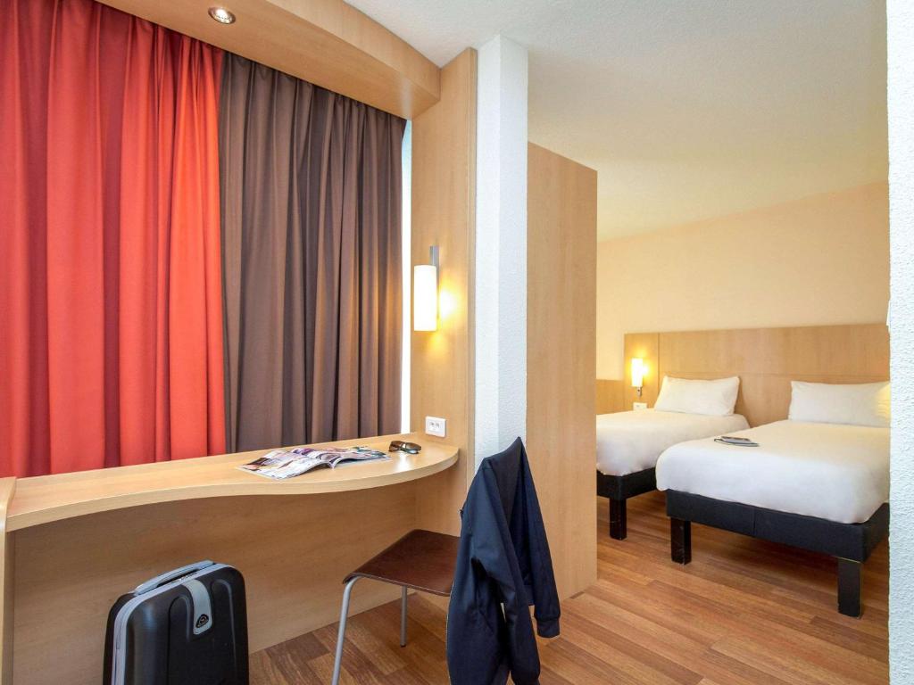 Postel nebo postele na pokoji v ubytování Ibis Cavaillon Portes du Luberon