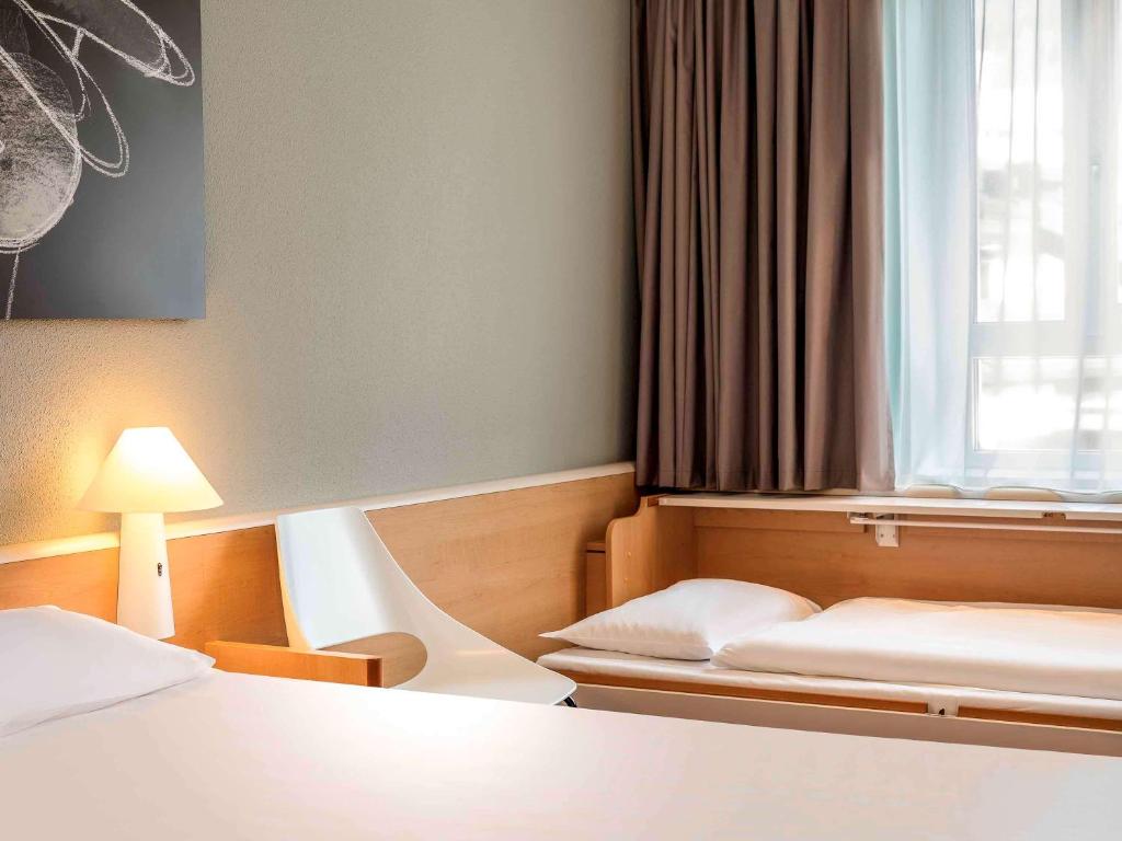 Postelja oz. postelje v sobi nastanitve Hotel Ibis Bregenz