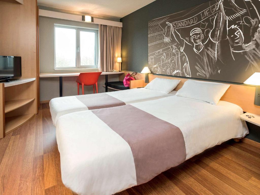 Postel nebo postele na pokoji v ubytování ibis Liège Seraing
