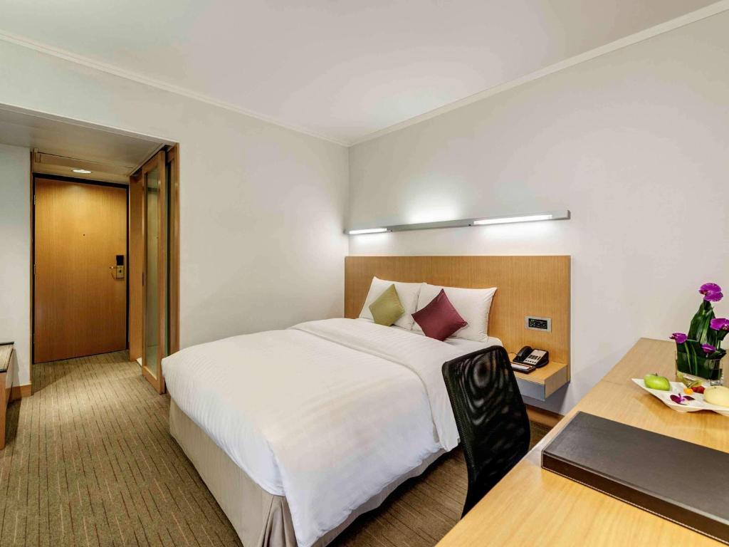 Postel nebo postele na pokoji v ubytování Novotel Century Hong Kong