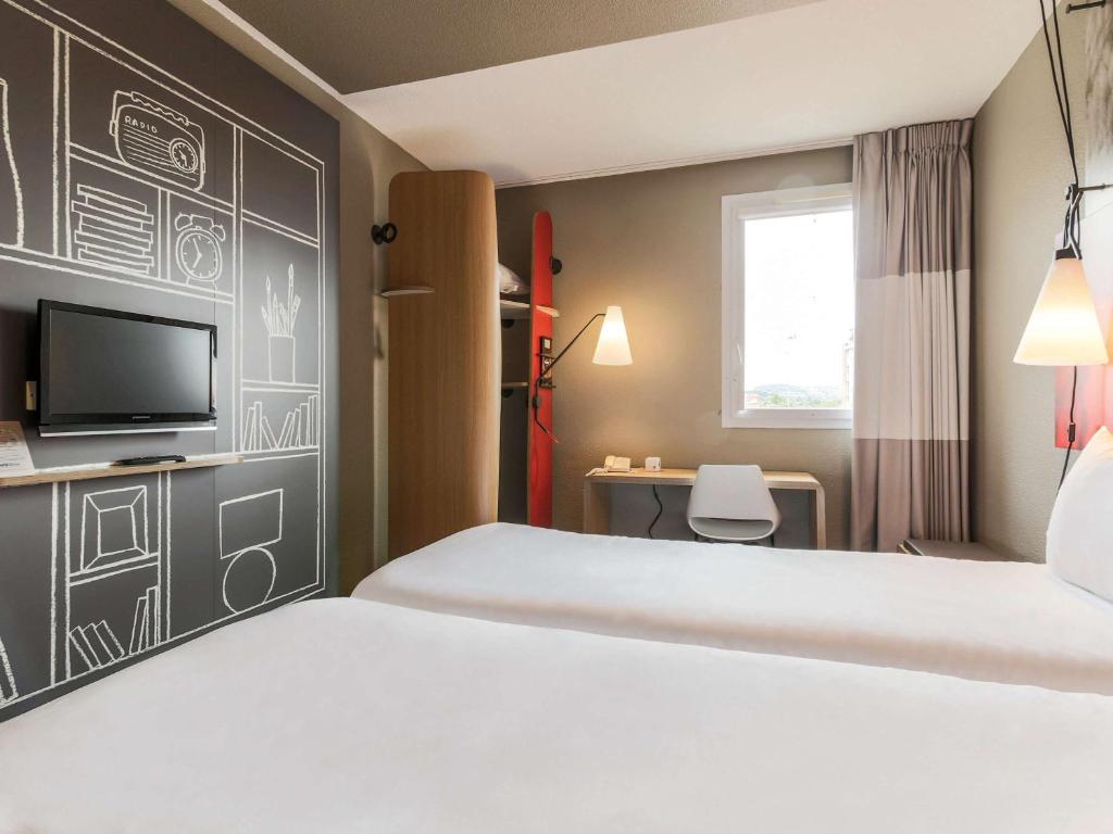 Postel nebo postele na pokoji v ubytování Ibis Albi