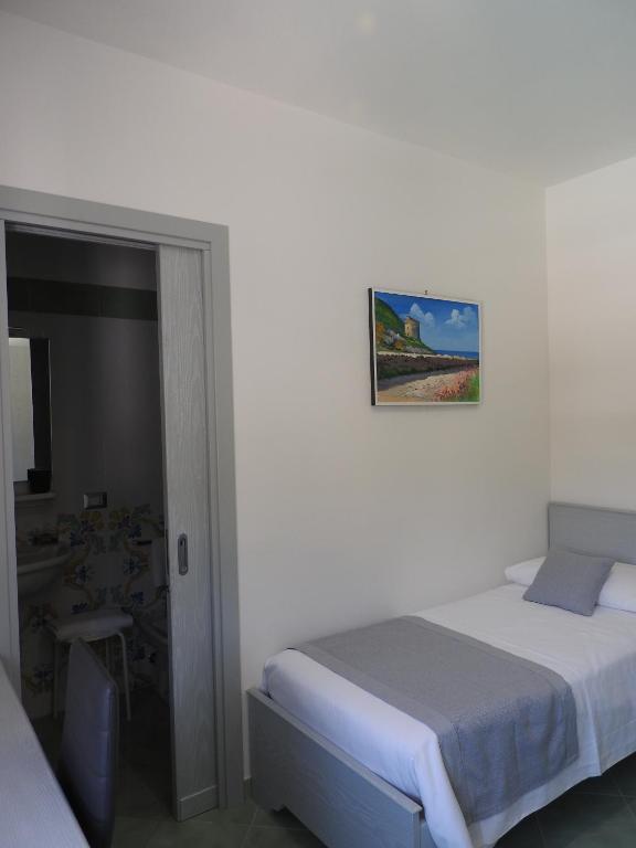 Postel nebo postele na pokoji v ubytování Hotel Corallo Circeo